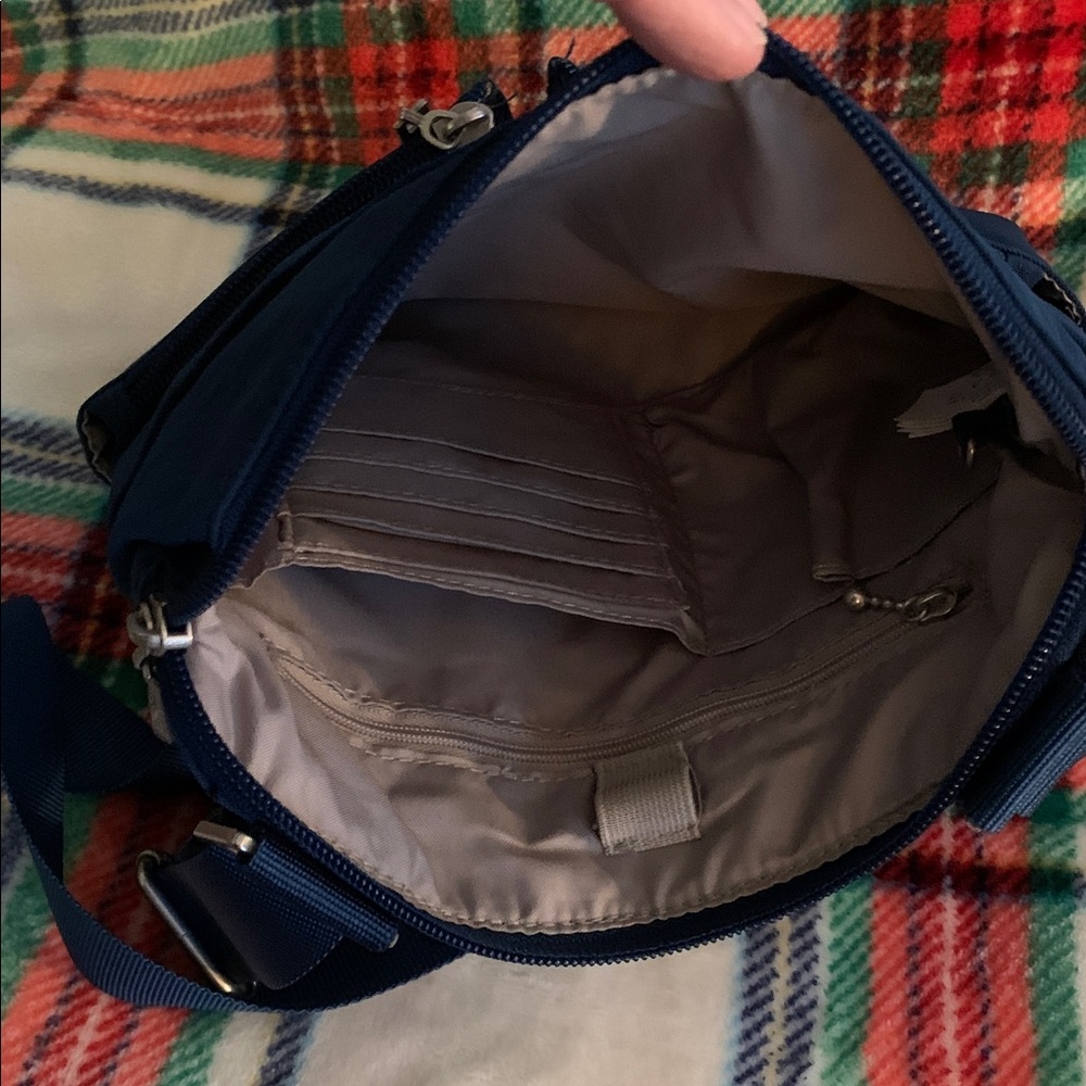 Baggallini Horizon Crossbody bag in a peacock blue color.
Approximately 10”x10” - Picture 3 of 4